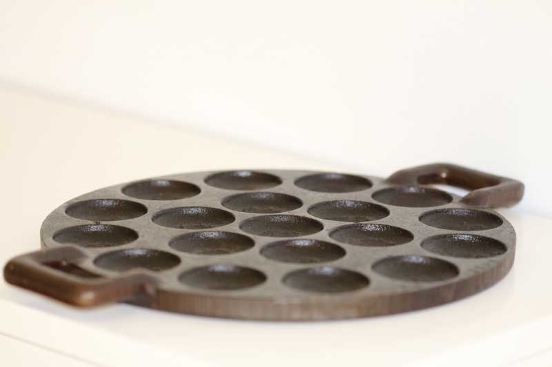 Seasoned poffertjes cast iron pan is essential for the authentic mini dutch pancajes